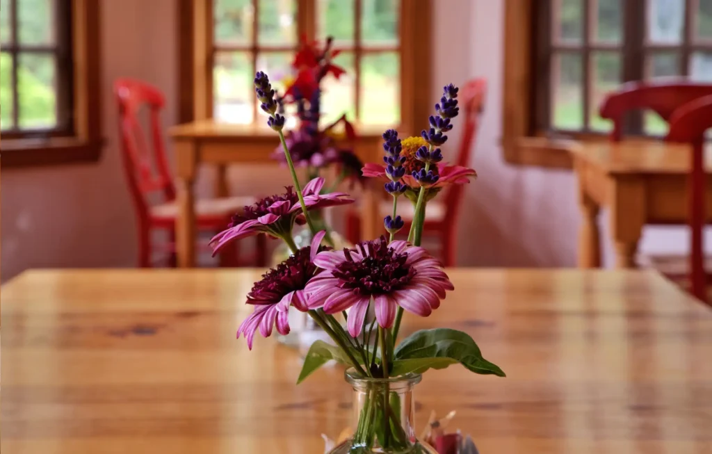 Fresh flowers on a table in the common areas of Arch Cape Inn